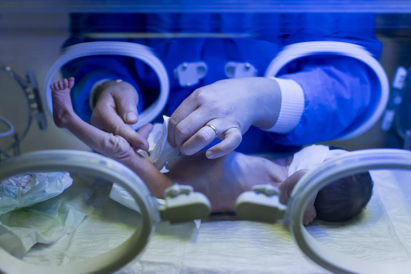 In Sulaymaniyah, Iraq, a health worker inspects a baby in an incubator at the kangaroo mother care facility. 