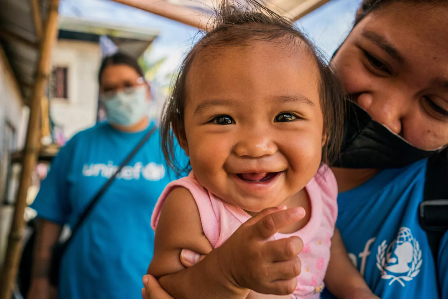 In Marantao, Philippines, 13-month-old Jonaila plays with her mother, a member of the UNICEF staff. She will receive her first routine vaccination the following day.