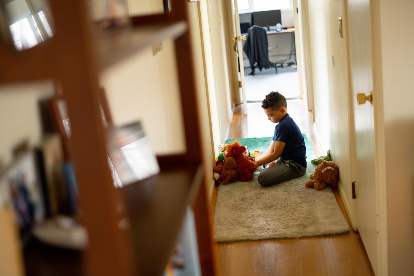 Coronavirus (COVID-19): Luka, 8, plays with stuffed animals in between completing school exercises on his first day of distance learning from home.