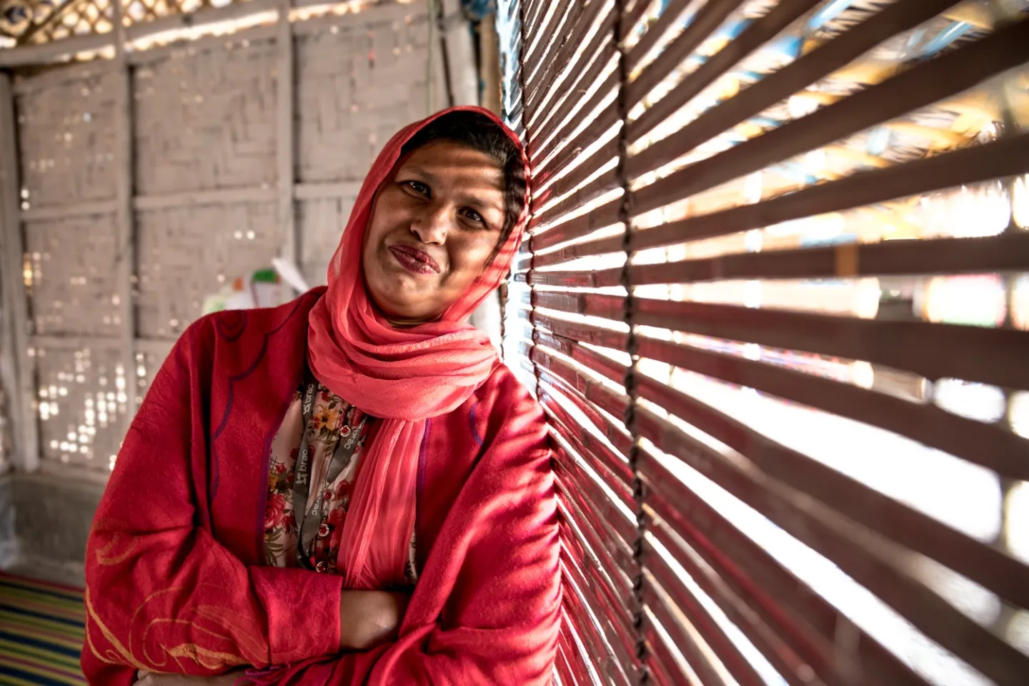 Bangladesh. The manager of a Safe Space for Women and Girls stands by a window.