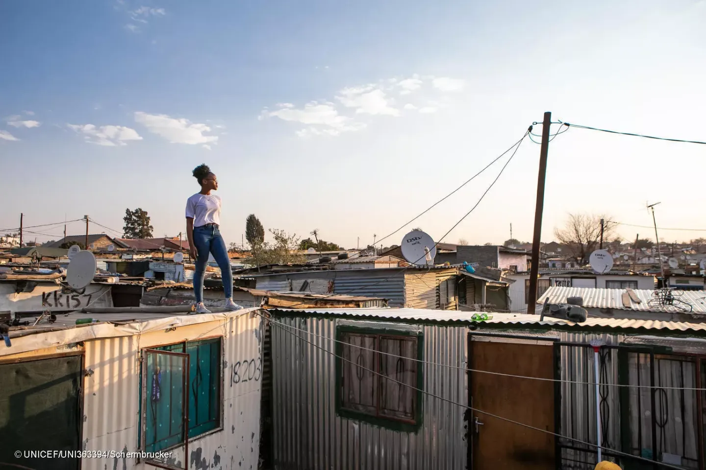  Sebabatso Nchephe, 18, stands on the roof of the home, an informal settlement on the outskirts of Johannesburg, South Africa.