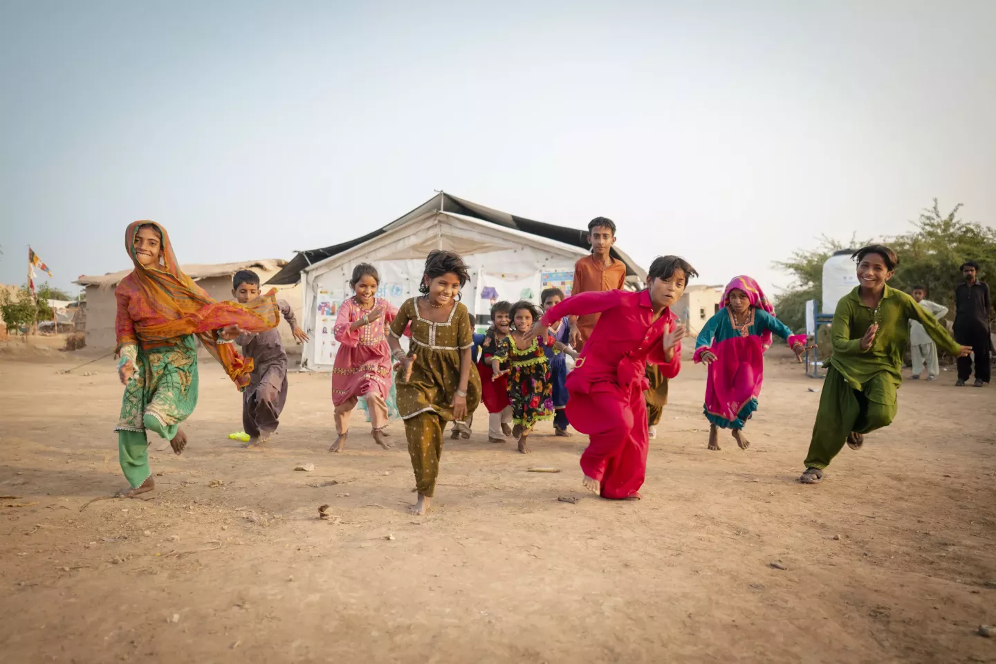 Children run towards camera