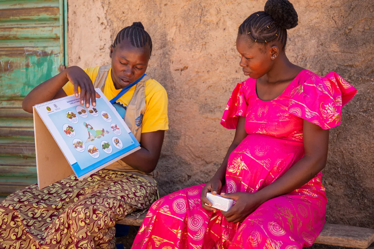 Burkina Faso. A community health worker explains the importance of MMS in Ziniar&eacute;.