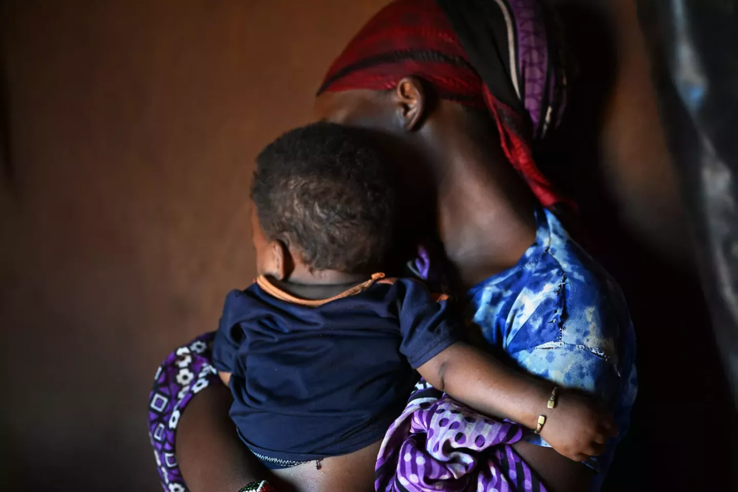 Loko, a 14 year old girl with her baby, at the Dubluk Wereda IDP site, in the Borena zone, Oromia region, in the south of Ethiopia. Loko is not her real name. The girl was raped but tells her story.