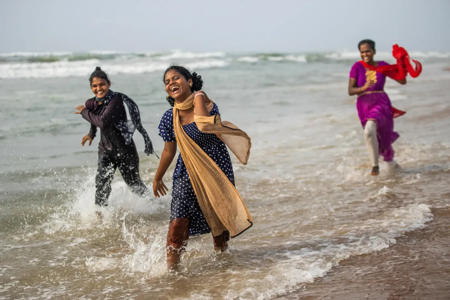 Advika group girls, who have said no to child marriage and yes to school, play at the beach.