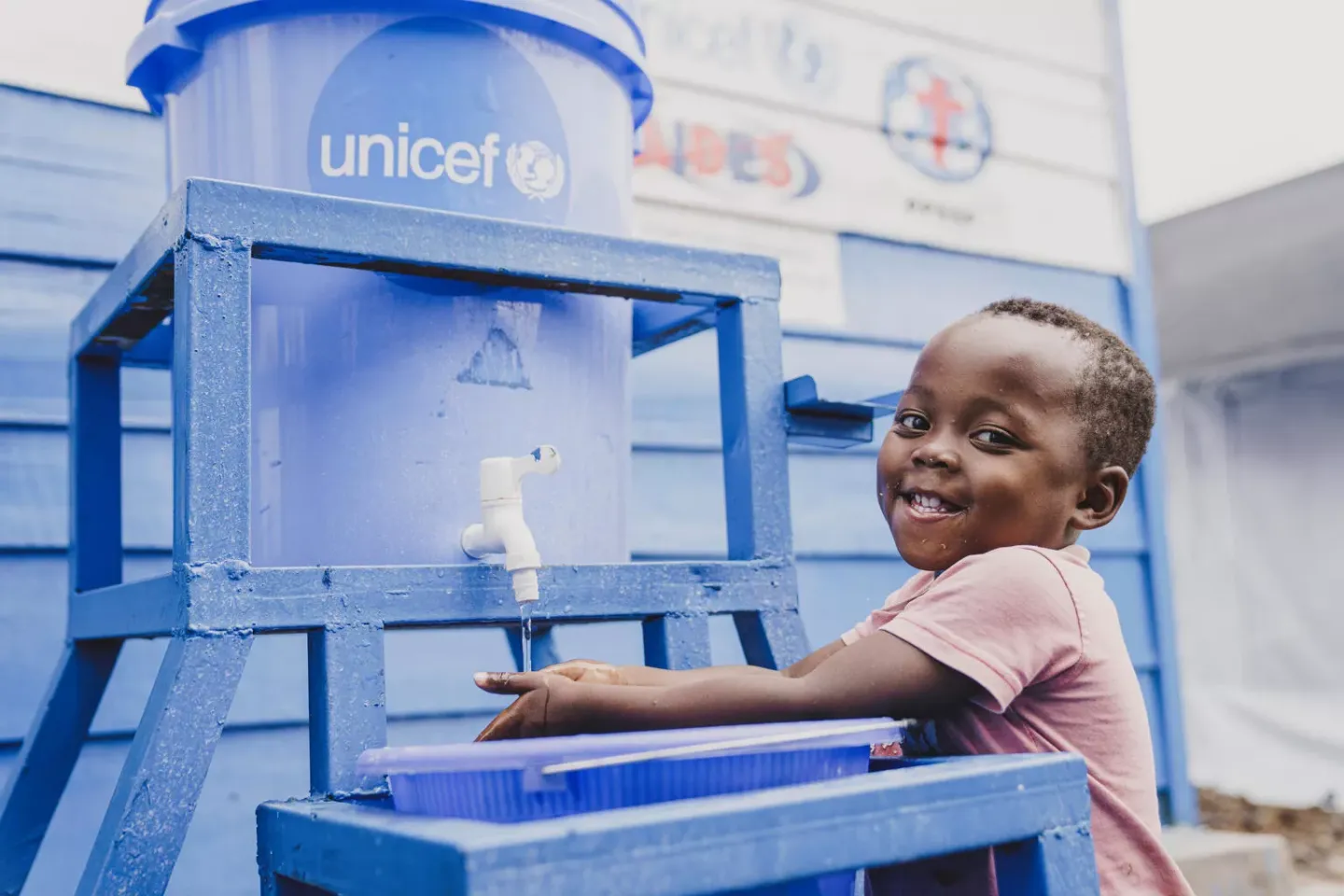 Fabien, 3, washes his hands before his meal at the UNICEF-supported mpox treatment center in Bisengimana, Goma, North Kivu province in DR Congo on December 3, 2024.