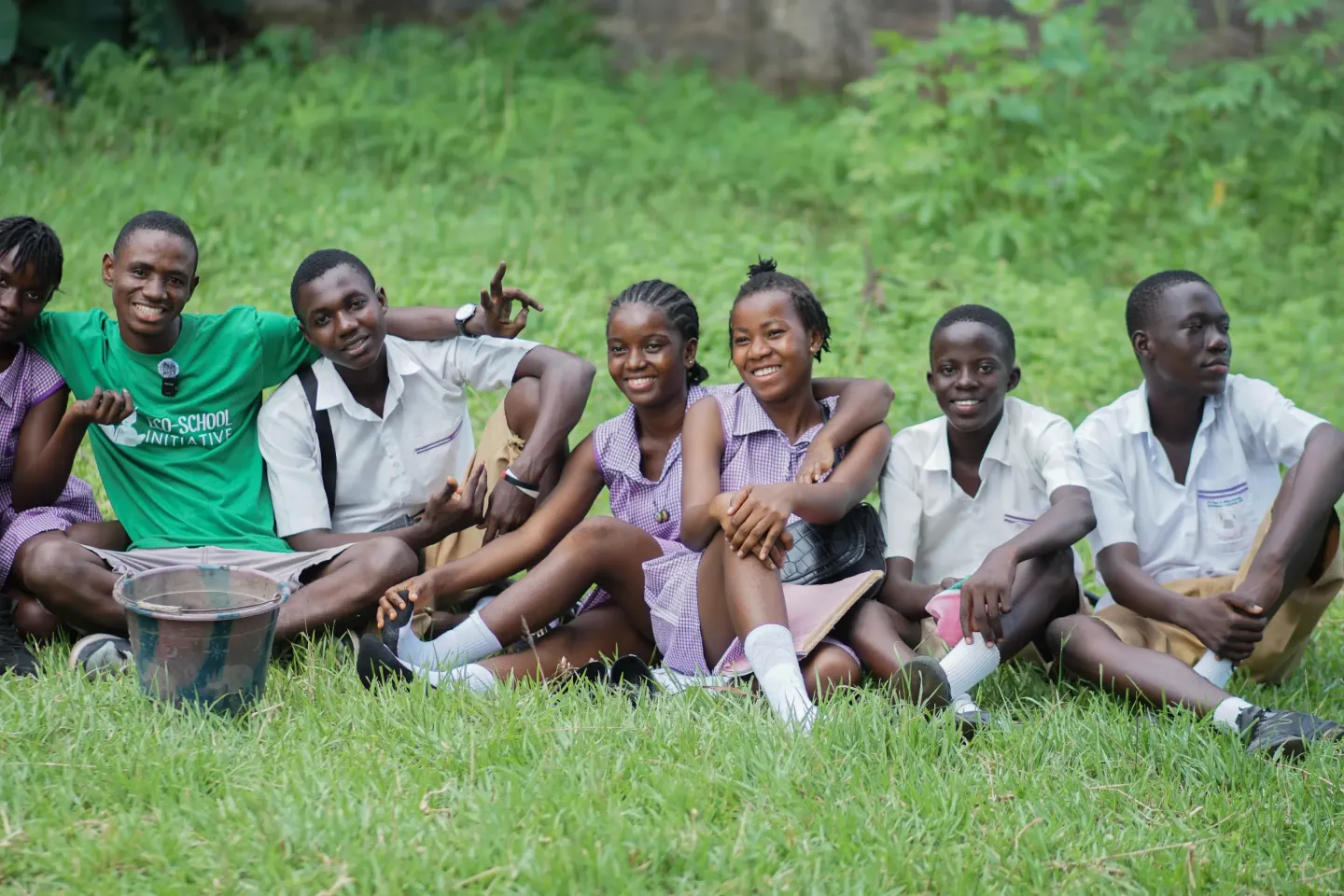 On 18 June 2025 in Bo, Sierra Leone, Michael Nabieu &nbsp;(in green T-shirt) sits for a photo with student members of the Green Club at St. Paul's School, after leading a practical session on using agricultural waste in compost preparation.