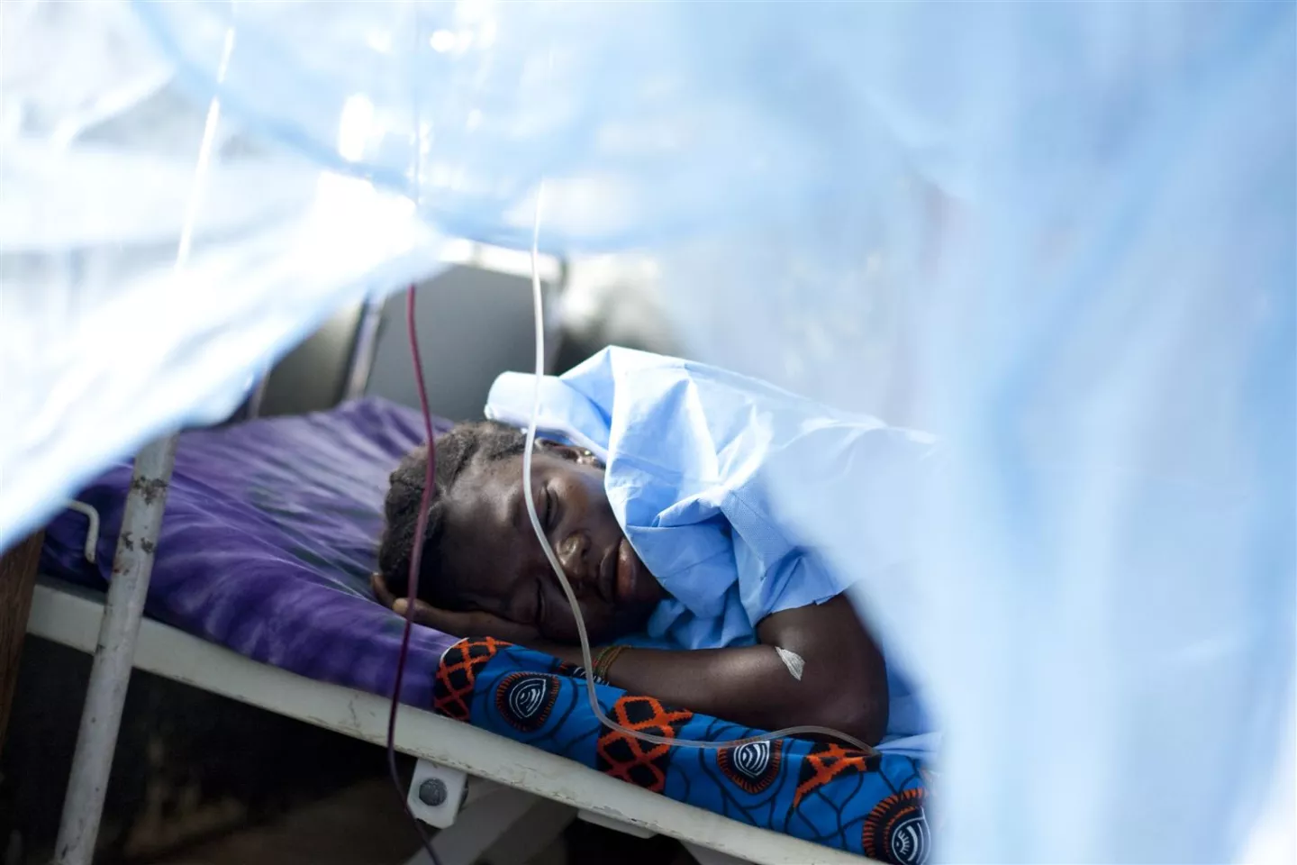 A woman in Sierra Leone sleeps after giving birth to a stillborn baby at home after 10 hours of labour. She was brought to the hospital for emergency removal of a retained placenta. Of eight pregnancies, she has four surviving children.