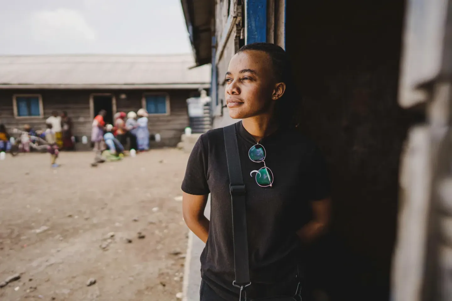 Democratic Republic of the Congo. Esther Nabintu, a U-Reporter, stands in front of a classroom in North Kivu province.