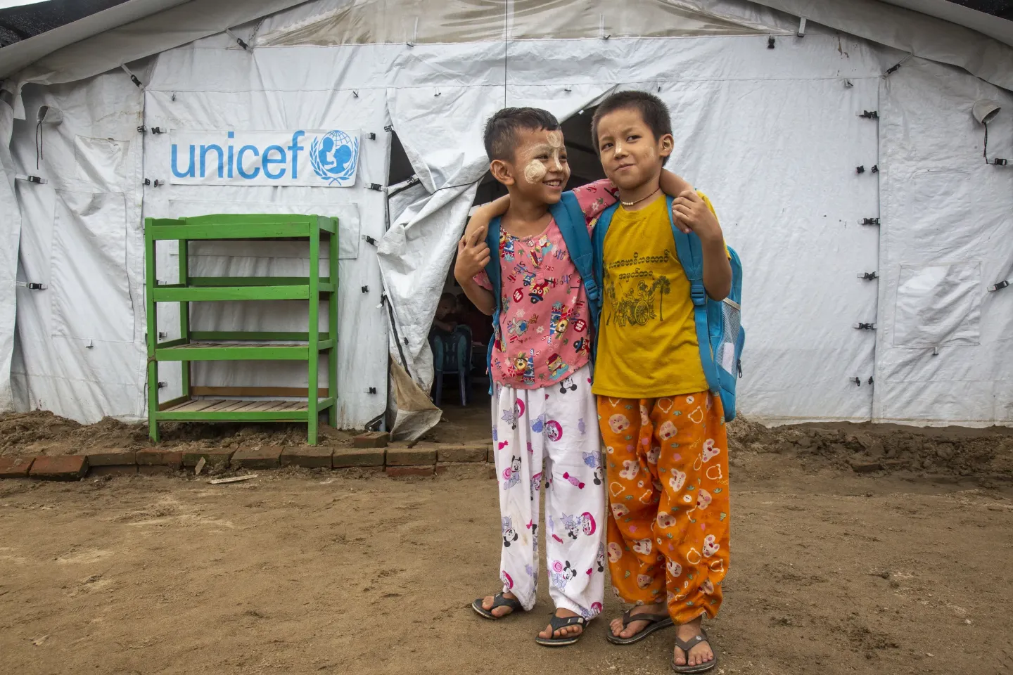 againg Region, Myanmar, 25 September 2025 &ndash; Myat Min Paing, 7 (left), and Kaung Htet Aung, 9 (right), stand together in front of a UNICEF-supported temporary learning shelter at a monastic education centre in Sagaing Region. 
