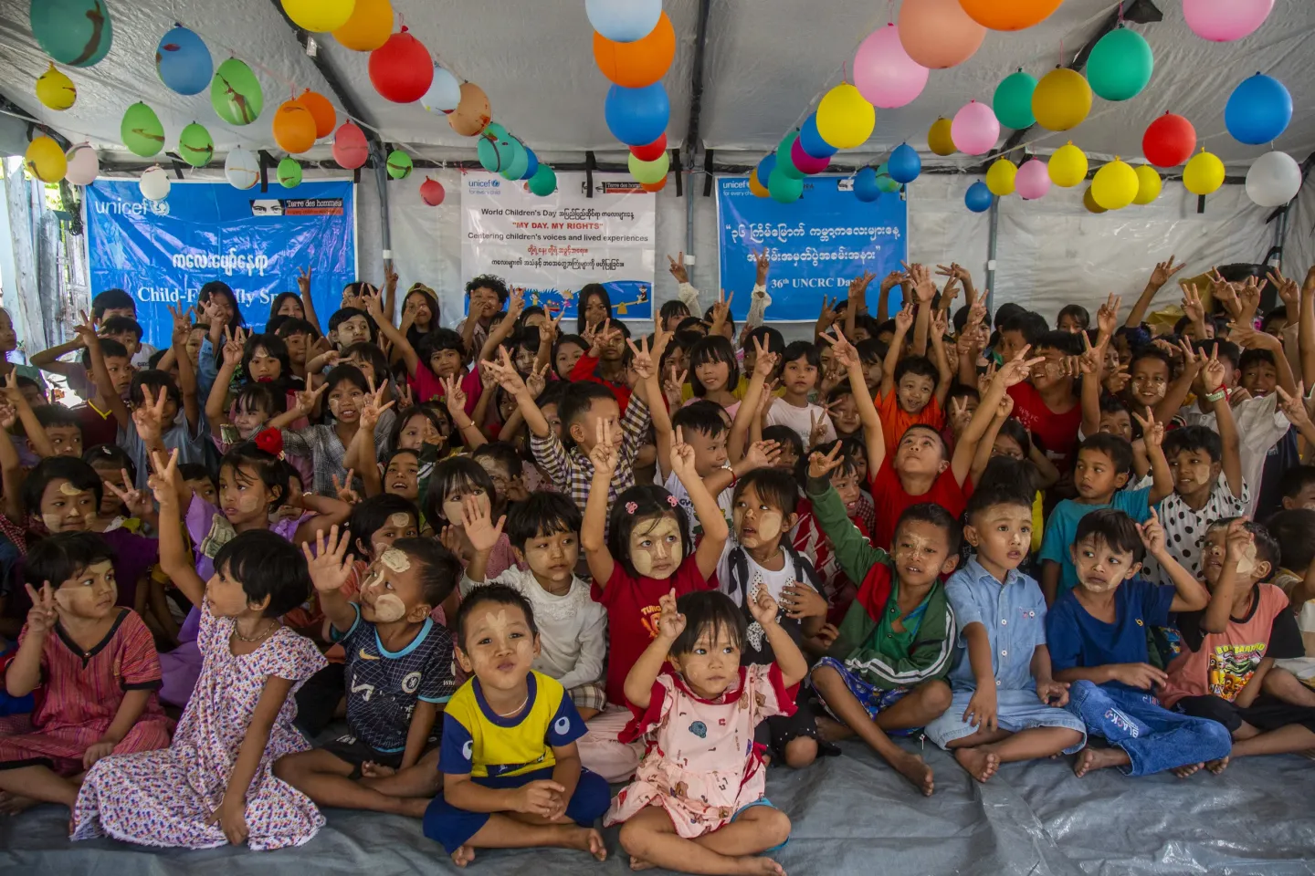 Children sit together while participating in World Children's Day