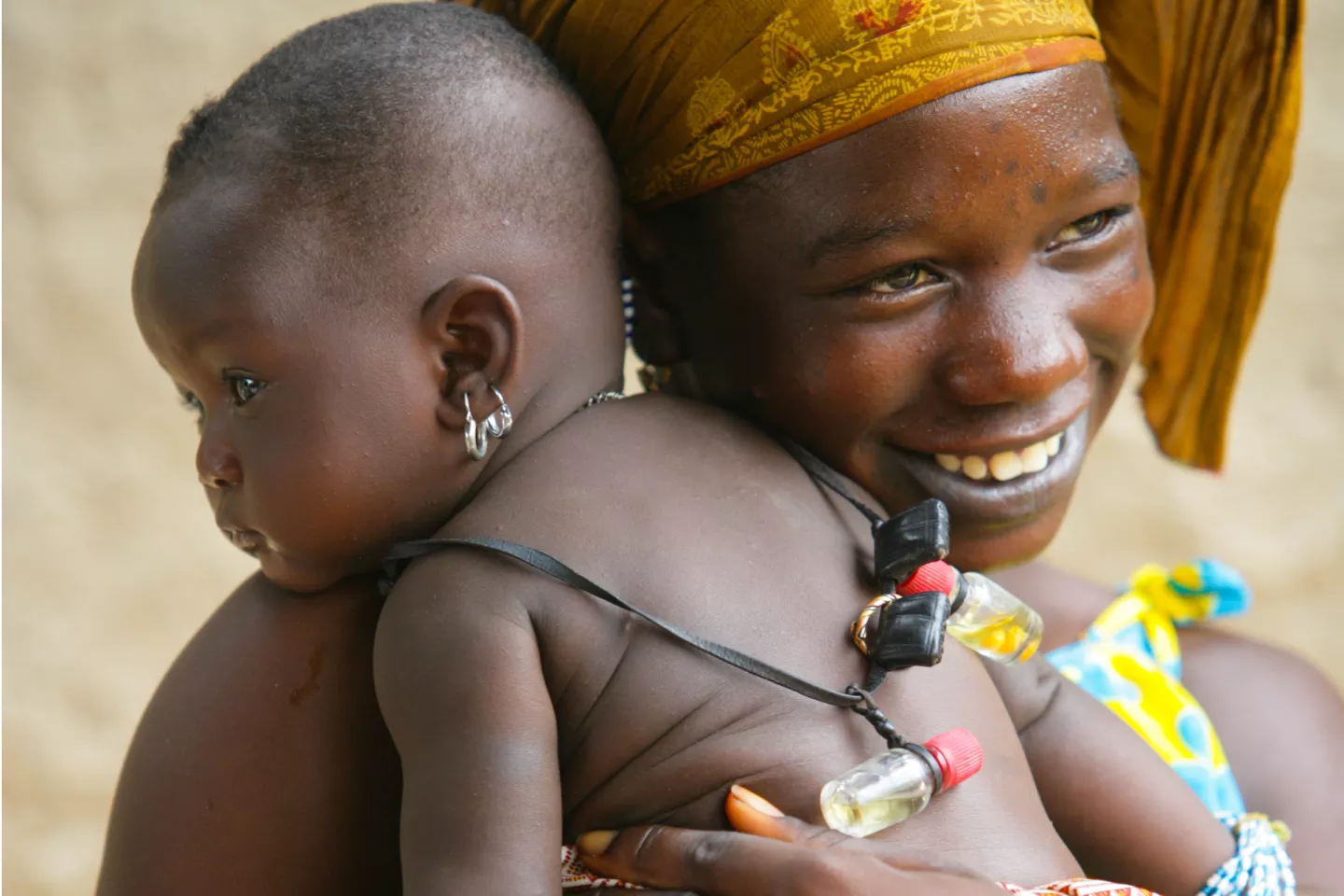 A mother hugging her child.