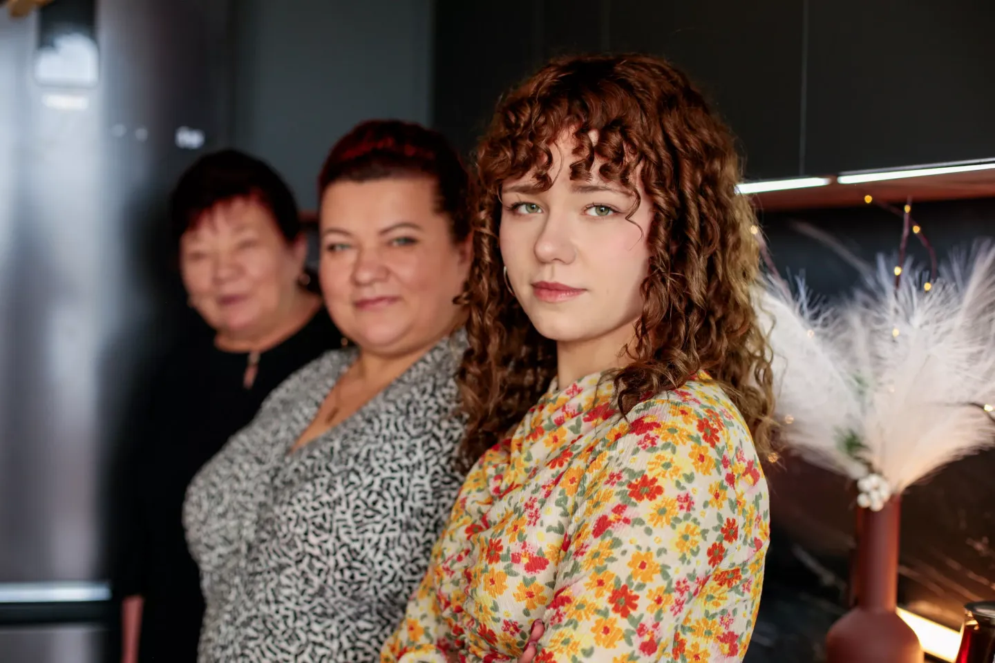 Portrait of Nadiya with her mother Olena and grandmother Tetiana in an apartment in the city of Rivne, Ukraine.