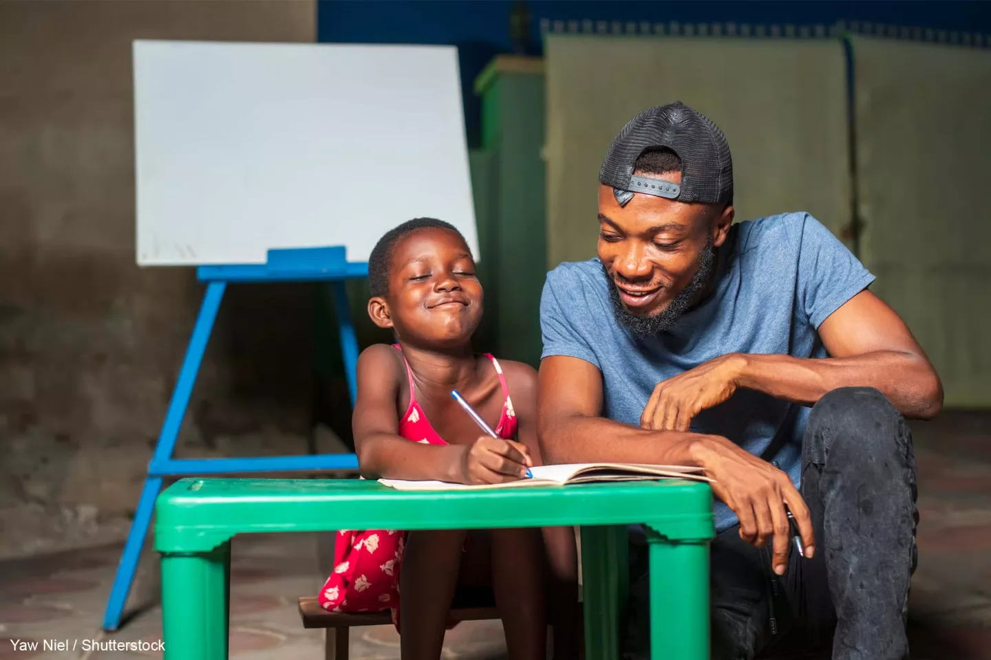 A parent teaching his child