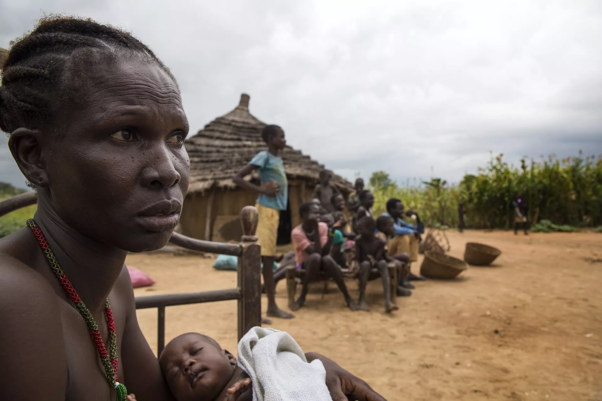 A woman breastfeeds a baby in South Sudan