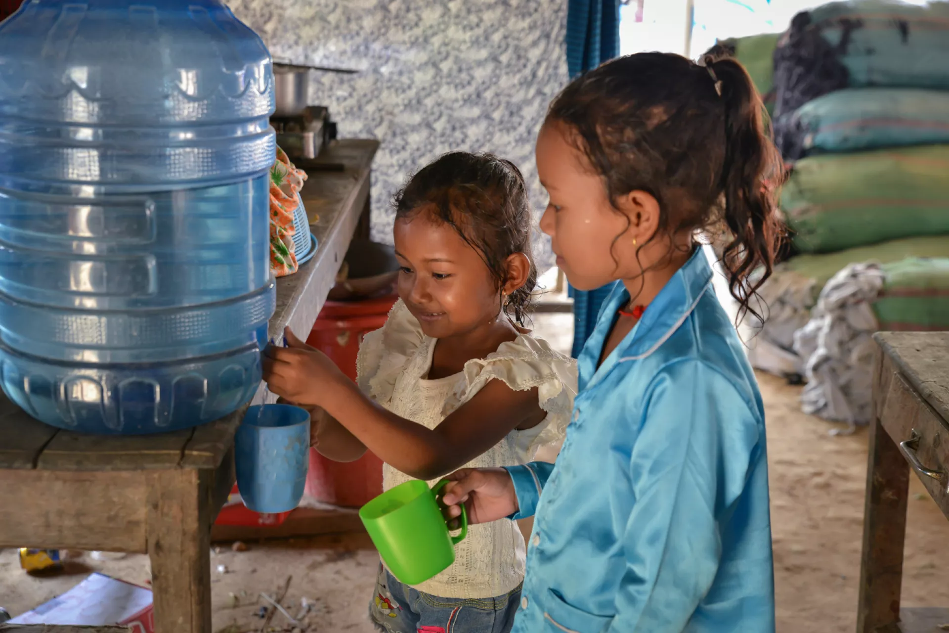 Mara, 5, and Nisa, 8, are no longer afraid of drinking water. Since UNICEF&rsquo;s intervention to bring water supply to their home in Bateay District, their family is having few health issues. 