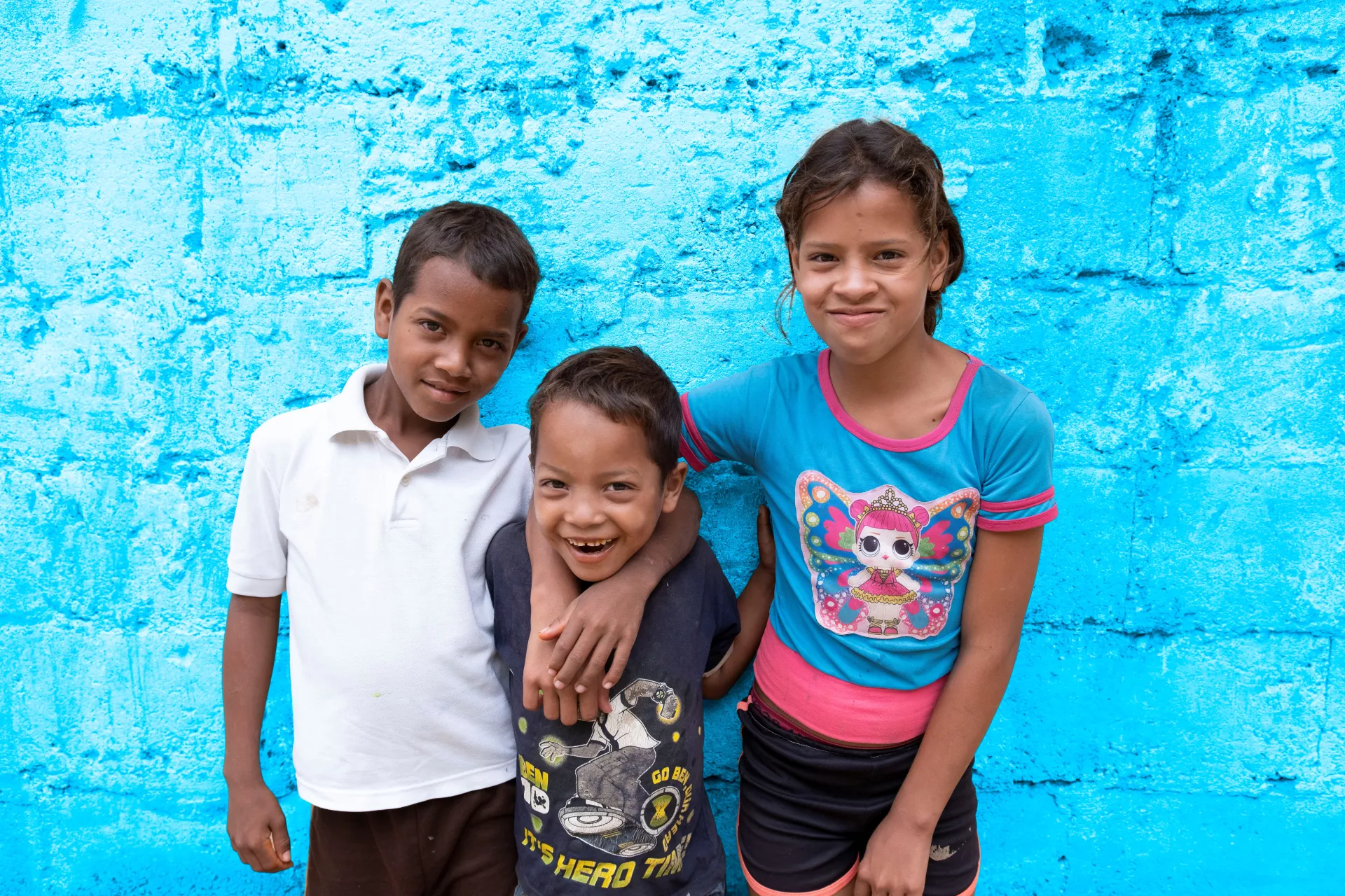 Three children in front of their house in Ni&ntilde;o Jesus neighborhood in Caracas, Venezuela