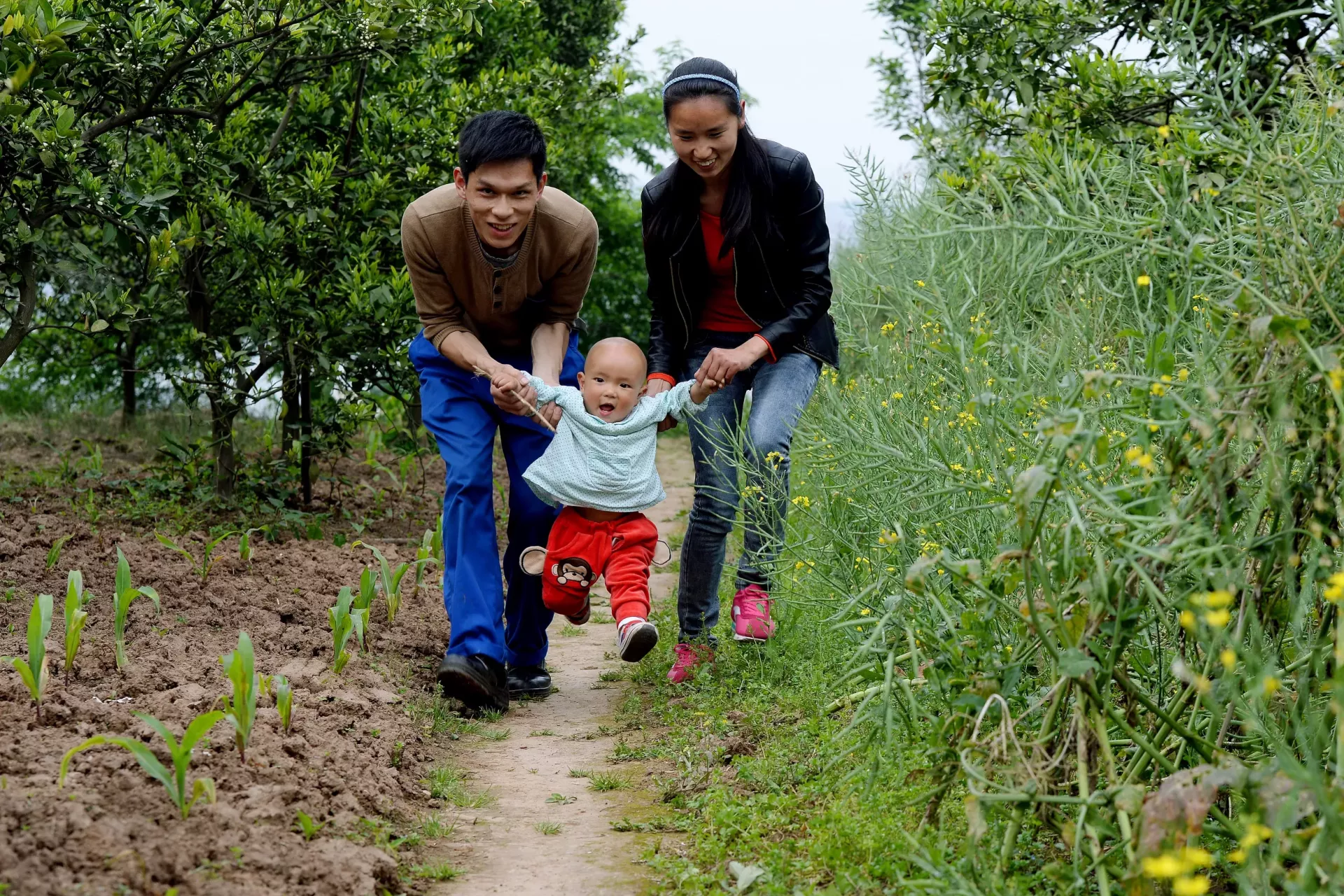 Parents playing with their child