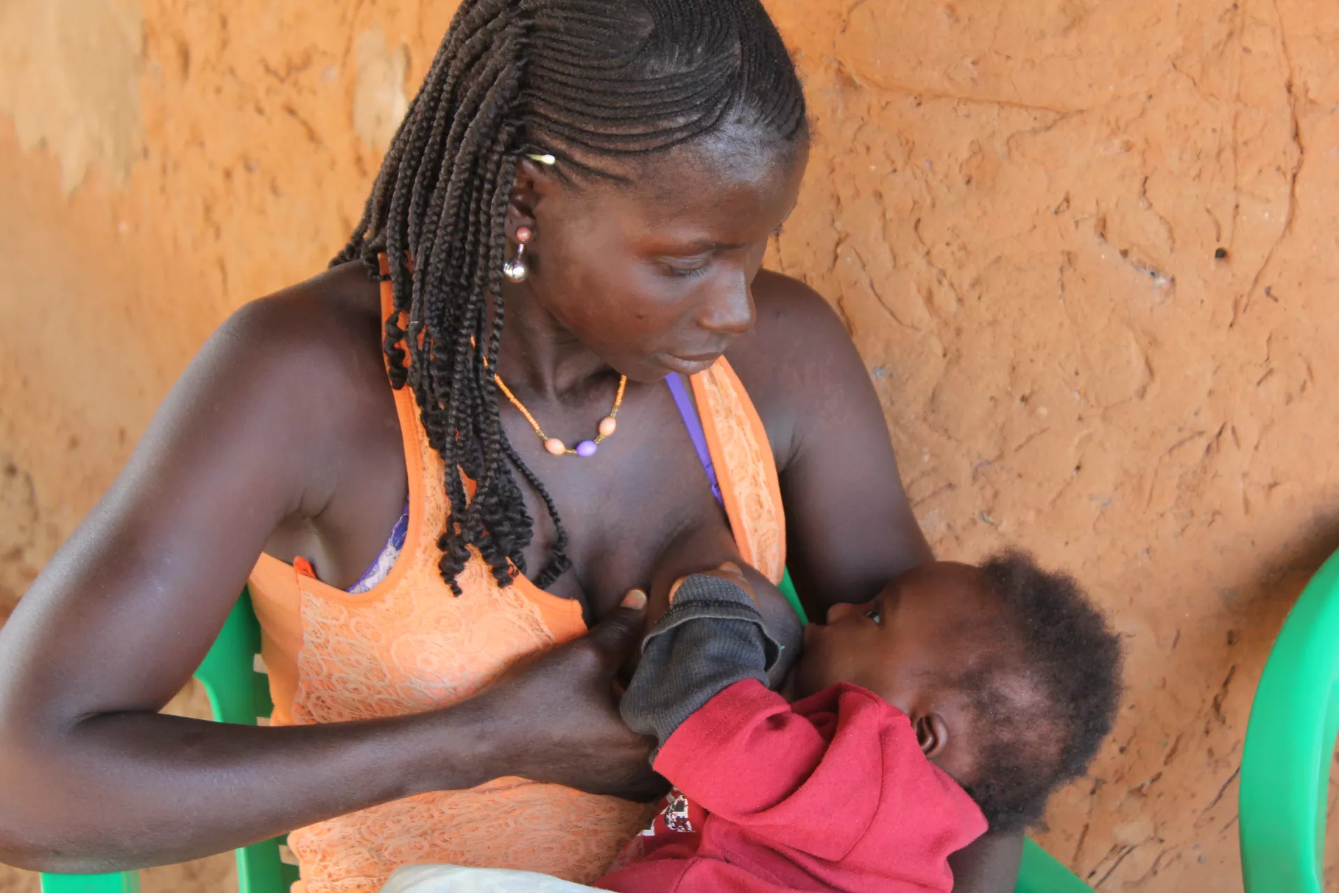 A woman breastfeeds her child, Guinea-Bissau