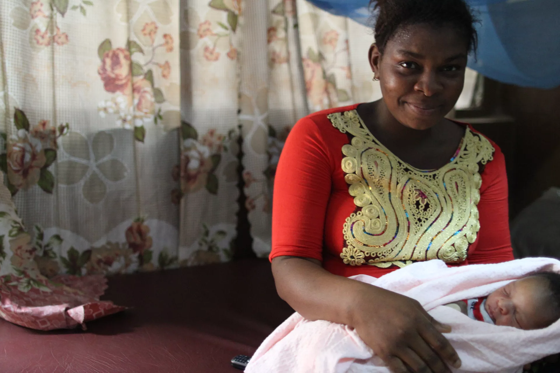 Zainab holds her baby boy few hours after giving birth to him.
