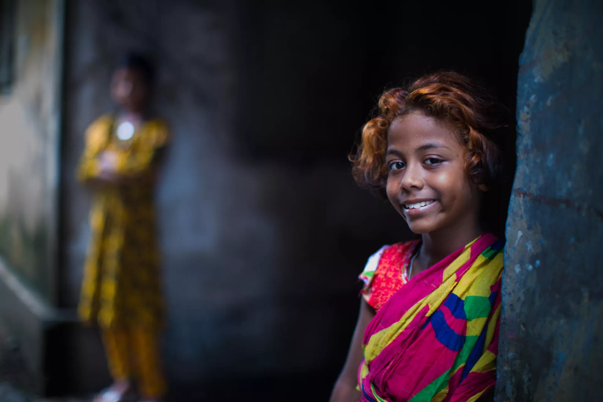 Dulaly, 10 stands with friends in Kamalapur, Dhaka. Dulaly collects garbage around old Dhaka train station, to be recycled to earn some money to support her family. Her father is a porter and her mother a housewife.