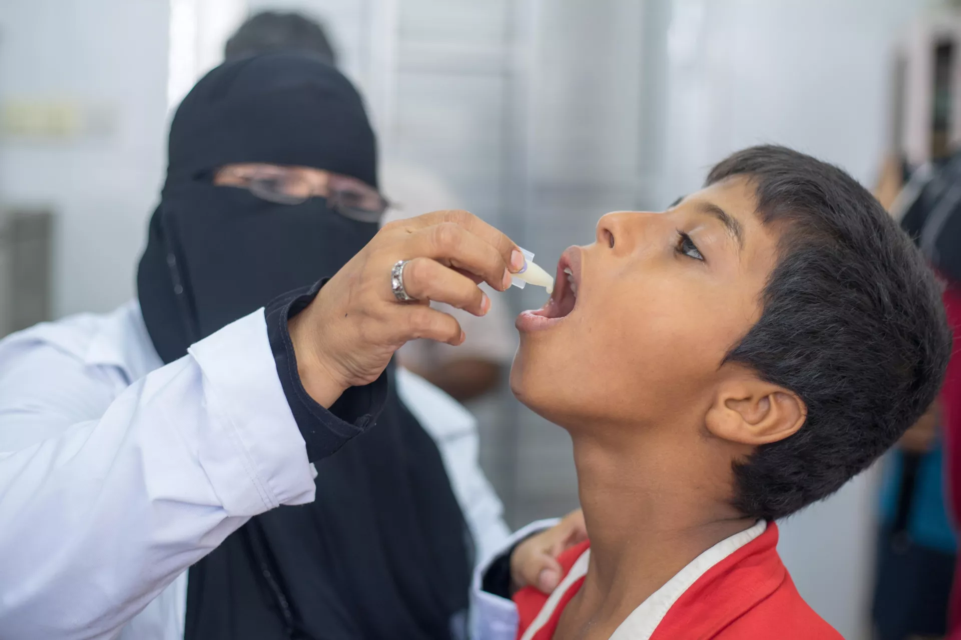 A boy receives an oral cholera vaccine, Yemen