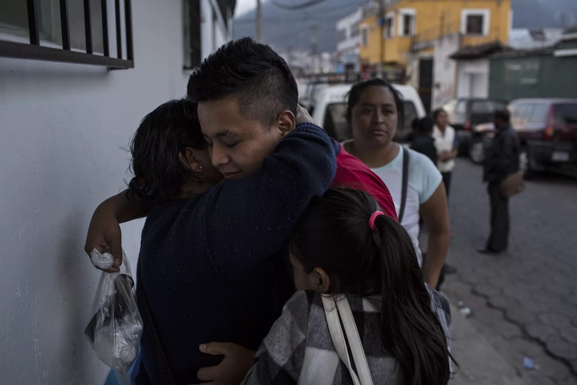 Guatemala. A boy hugs his mother after being reunited.