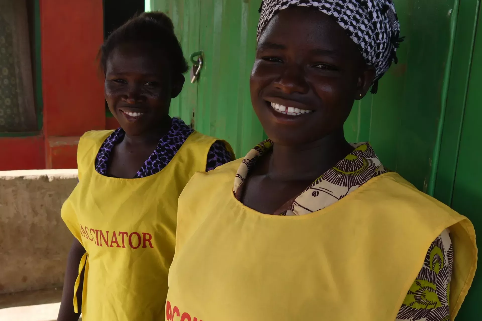 Female vaccinators stand in line in Ghana