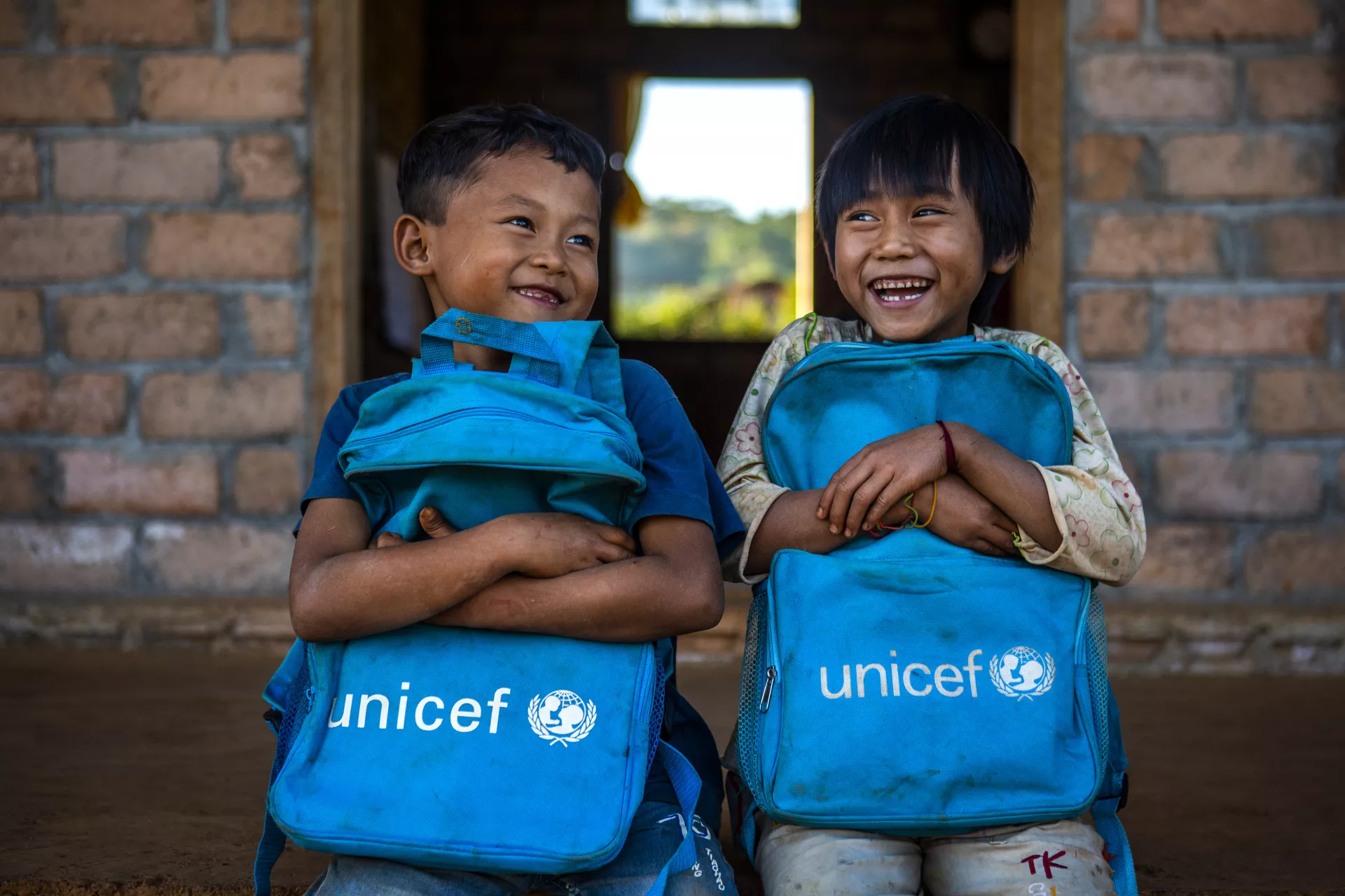 7-year-old students outside a classroom in Myanmar