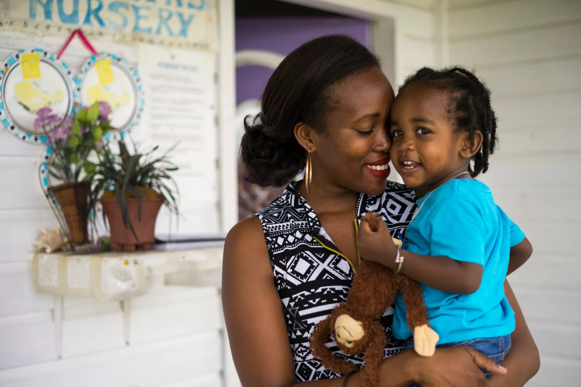 Denee Warner, 28, holds her 19 month-old son Justice Warner outside Marilyn&rsquo;s Nursery in Cottonground in Saint Thomas Lowland Parish on Nevis island, St. Kitts and Nevis.