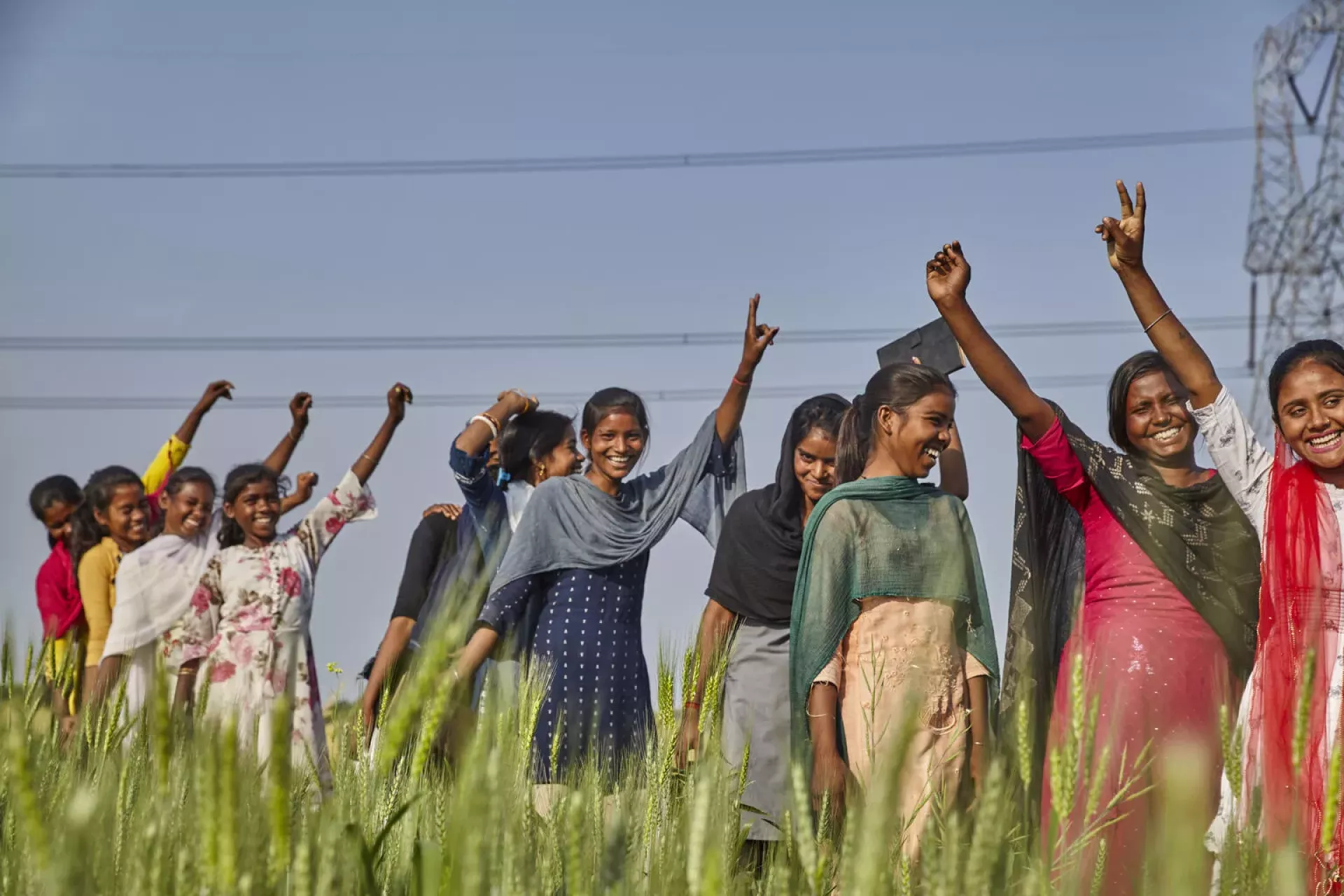 A group of adolescent girls enjoy a light moment together.