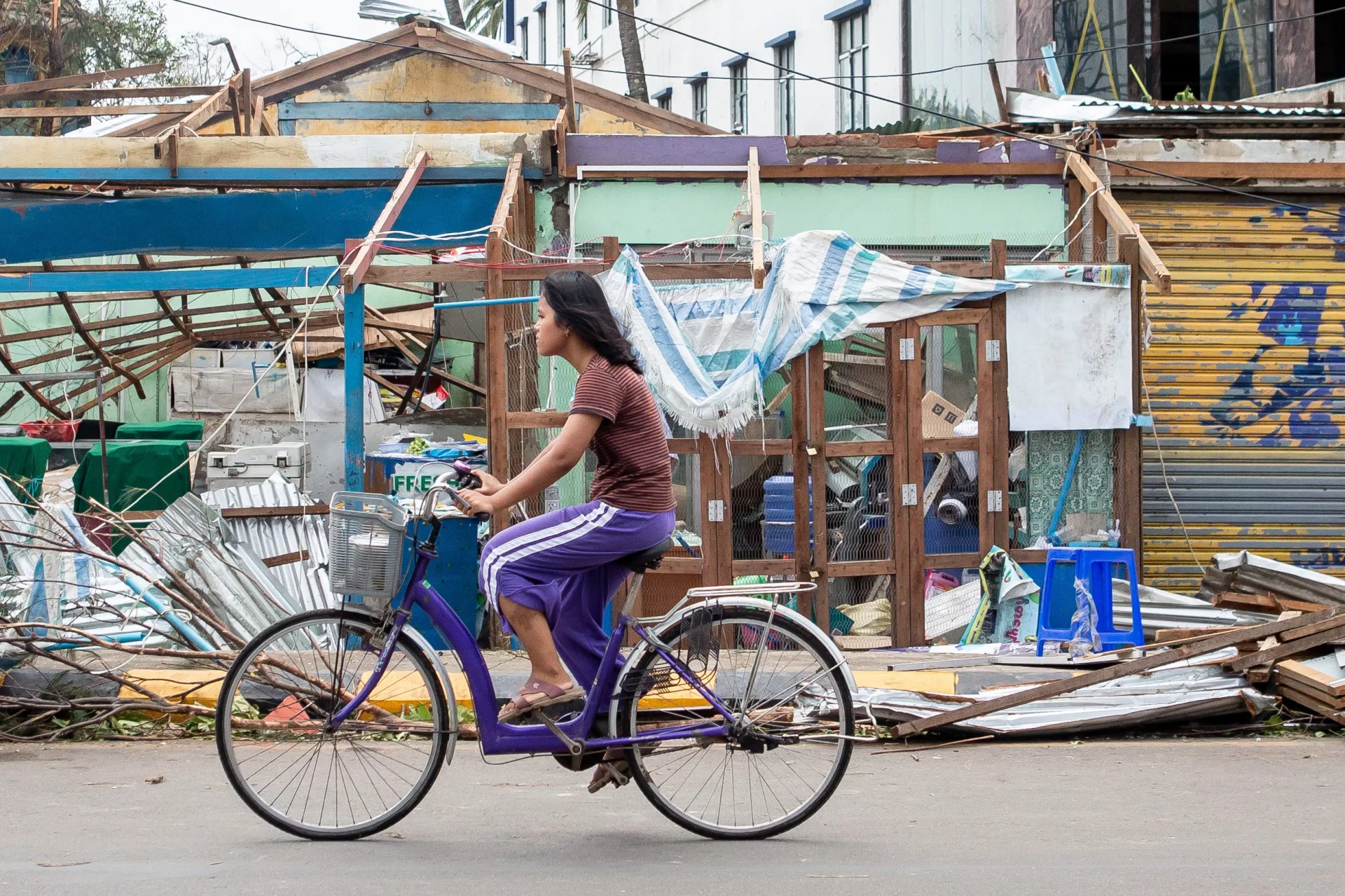 Girl on bicycle after cyclone