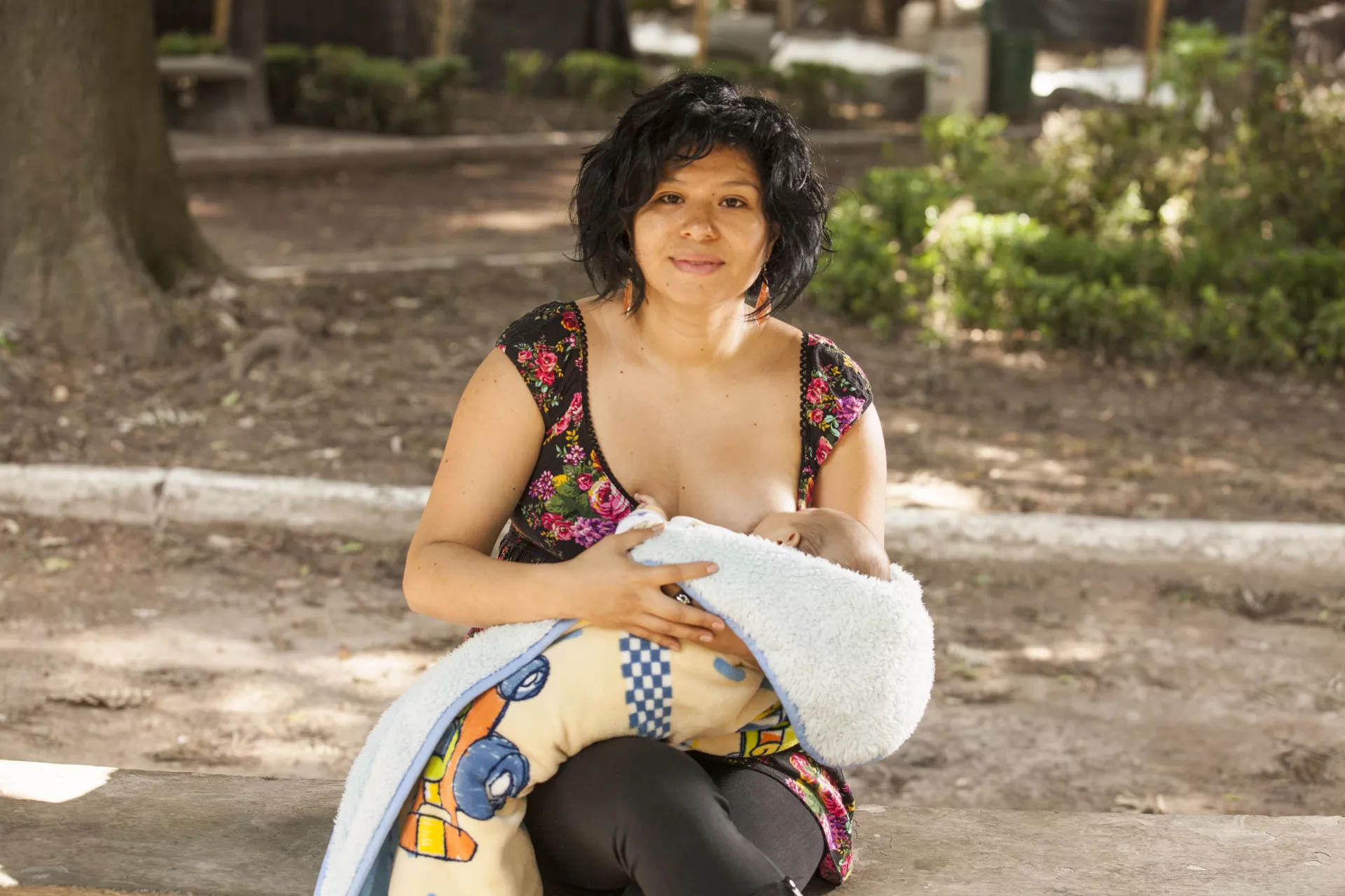 a woman breastfeeds a baby in Mexico