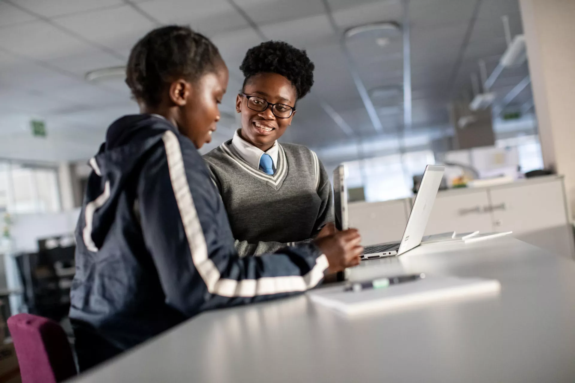 Sebabatso, 18, and and Bianca, 19, hone presentation preparation skills they learned during an internship at Roche Pty Ltd, South Africa