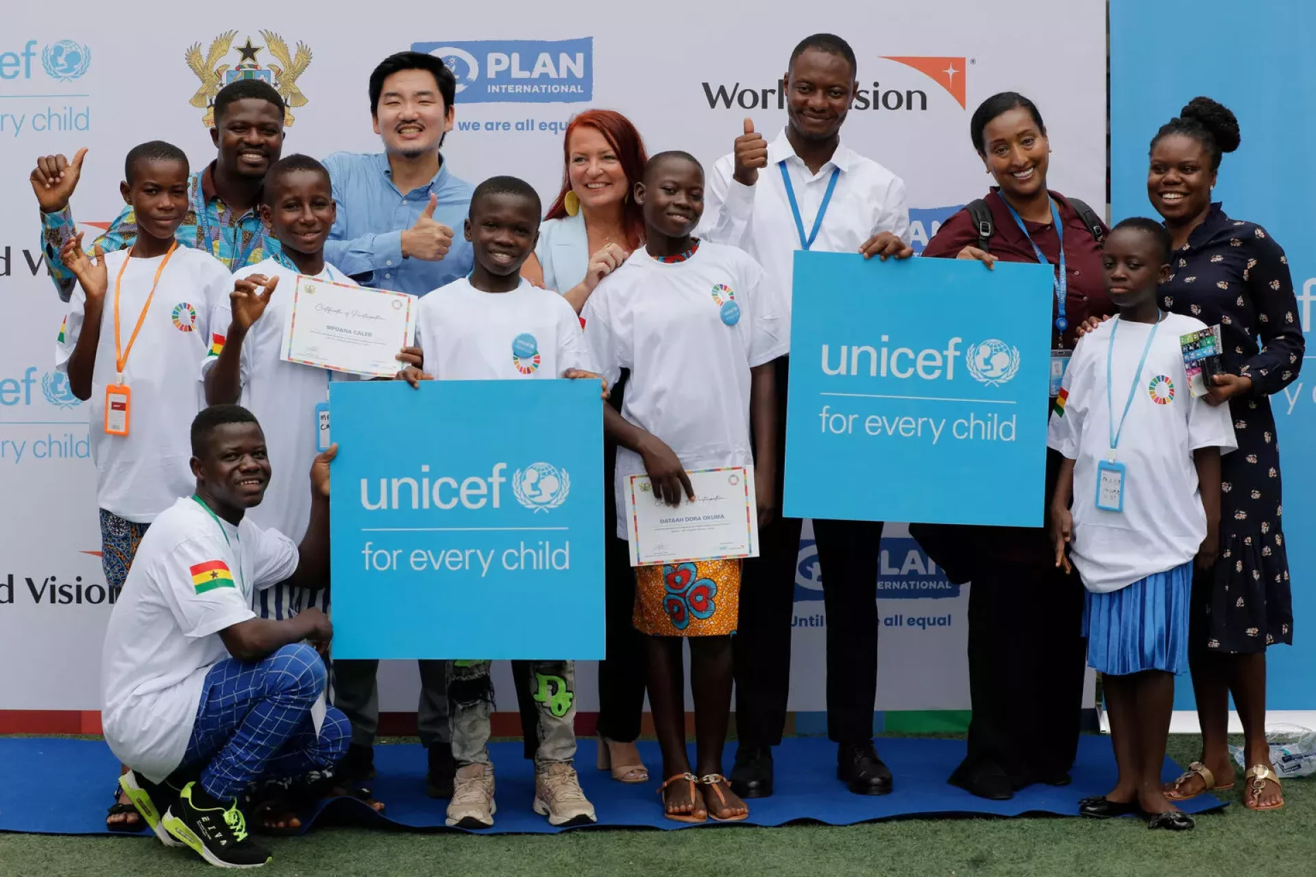 UNICEF staff and participants pose for a photo during the Children's Model Summit of the Future on SDGs