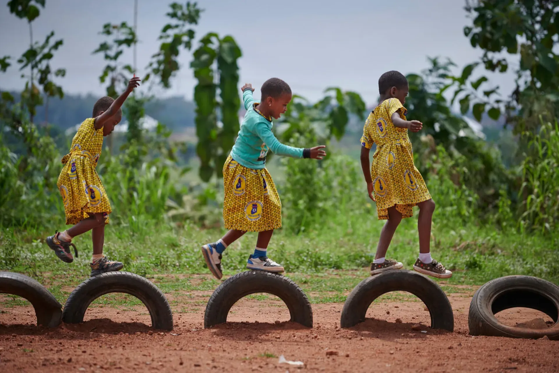 During a break, girls hop tires in a playground at Atia Methodist Primary School in Juaben Municipality in Ashanti Region of Ghana.