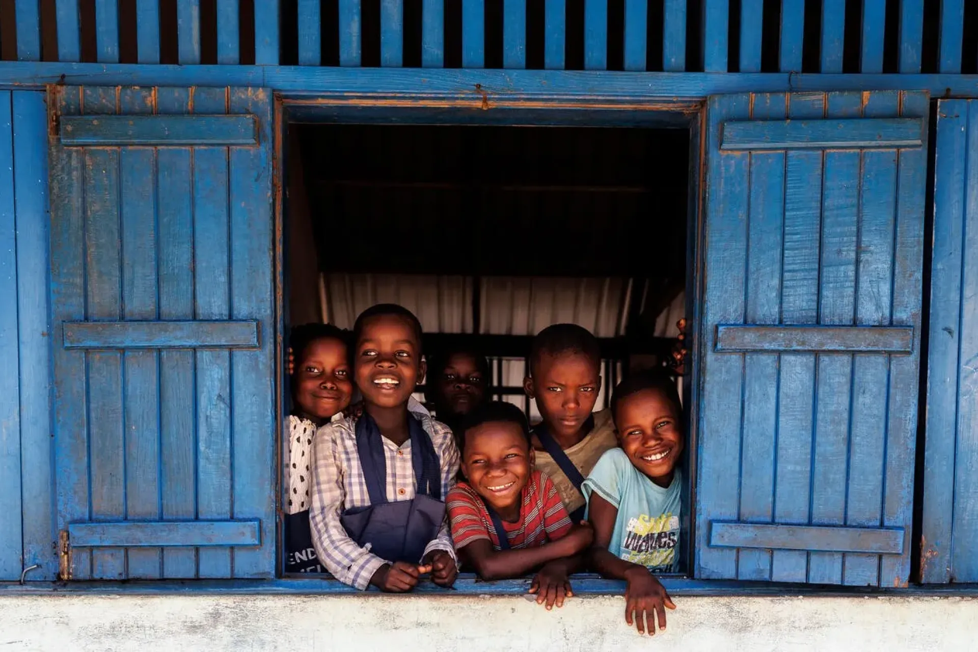 At Sanbebe School in Mozambique, students gather with joy where classrooms once stood roofless after Cyclone  Chido struck in December 2024. With support from the Government of Norway and the Today and Tomorrow  Initiative, UNICEF helped repair school buildings and provide learning materials, enabling 1,370 students to return  to safe classrooms and continue their education. 