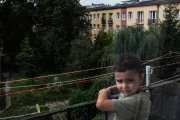 Mykyta on the balcony at his new home.