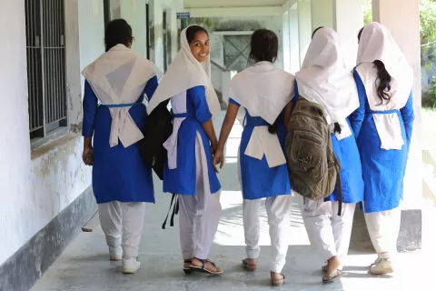 Shampa (15), second from left attends school with her classmates at Palli Mangal Girls High School, Bangladesh.