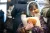 Ukraine. A girl hugs her toy as she takes shelter in a Kyiv metro station.