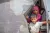 Yemen. Students look out from inside a tent hosting education sessions.