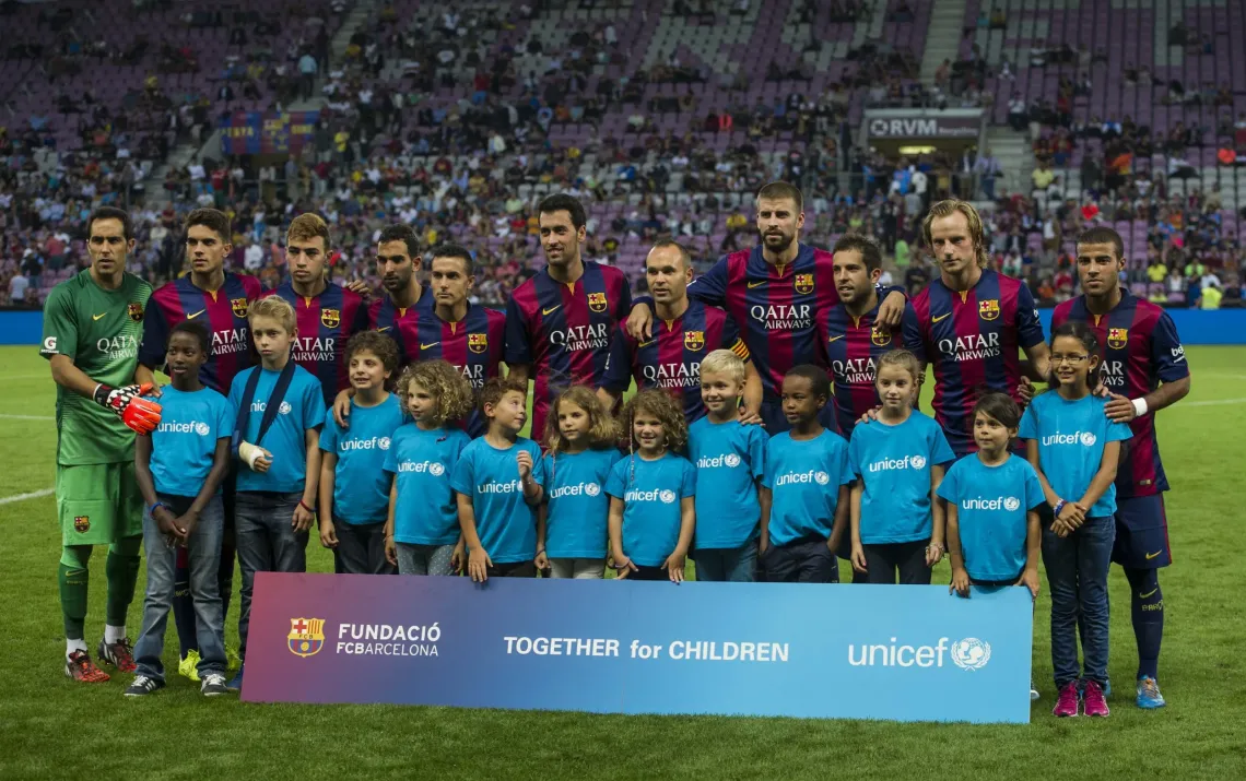 Barcelona football players with children