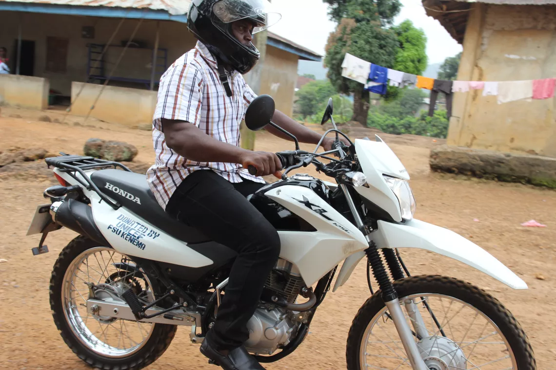 Police Constable Edward Smith rides on a motorbike 