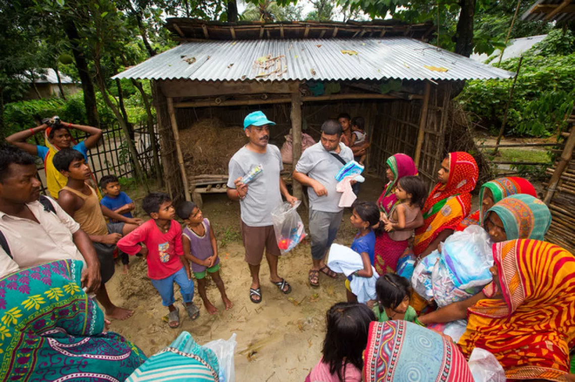 UNICEF staff distribute hygiene kits to a flood affected community in Nepal