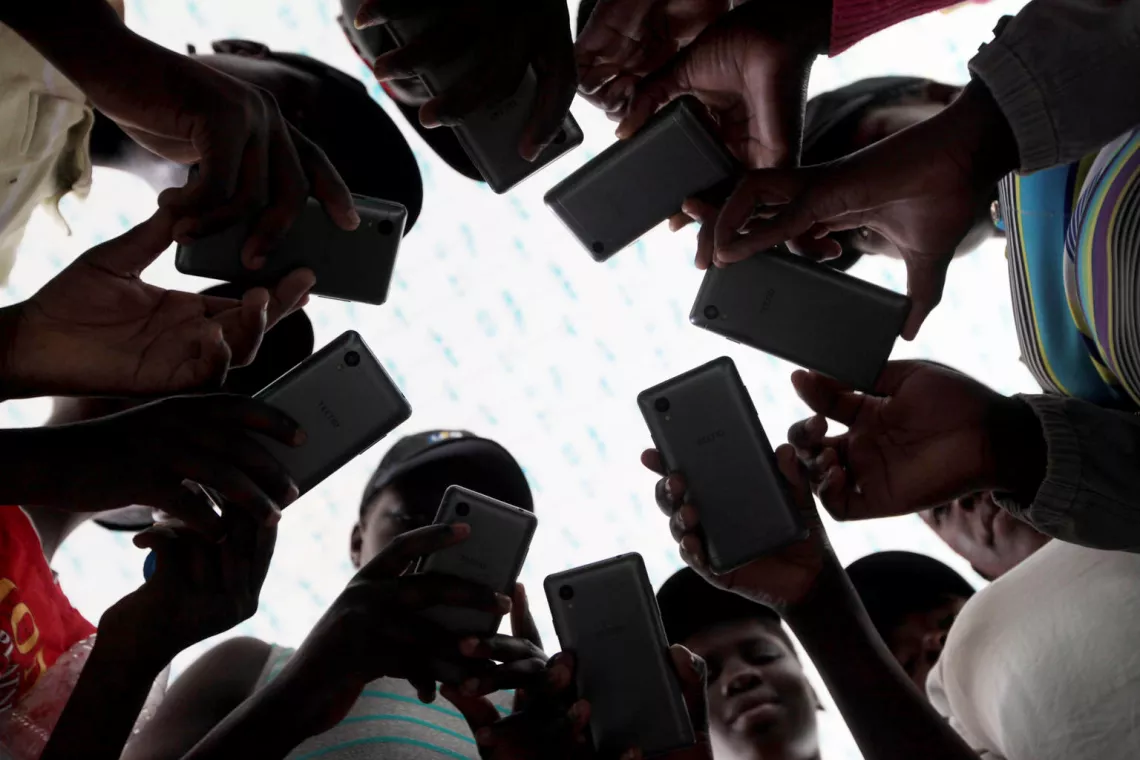 Young people undergo training for a mobile application at a centre in Zimbawe.