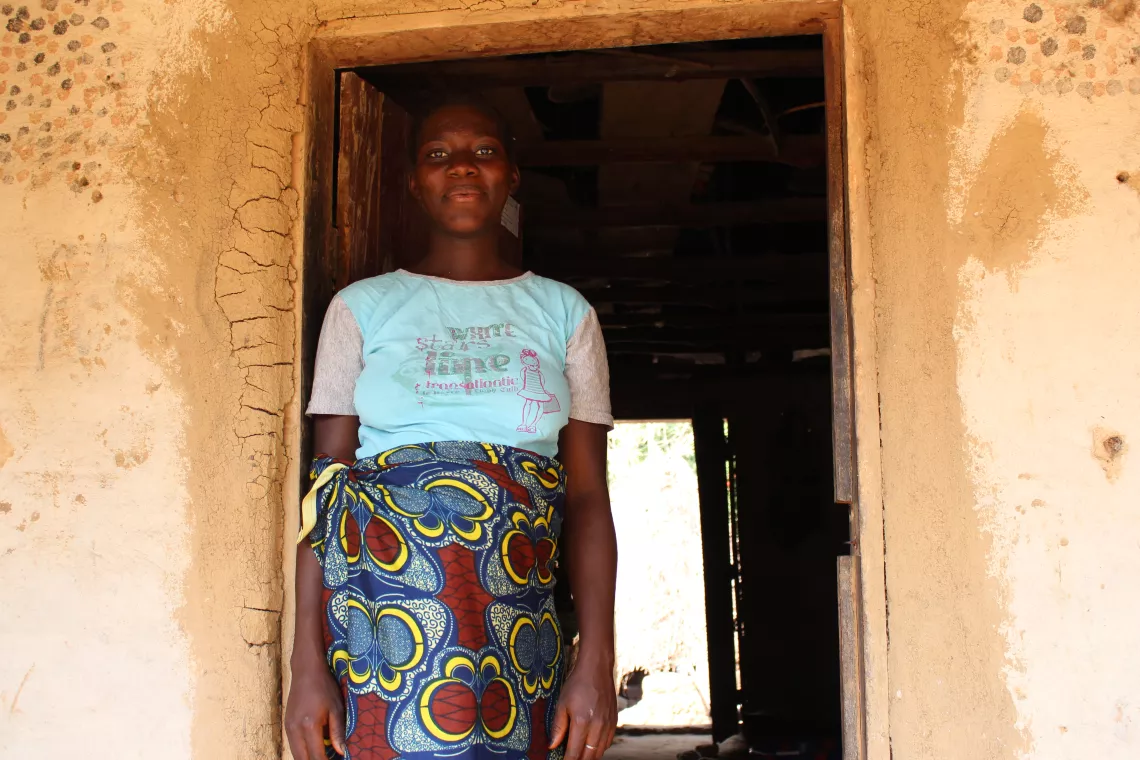 A girl stands in a doorway, Sierra Leone