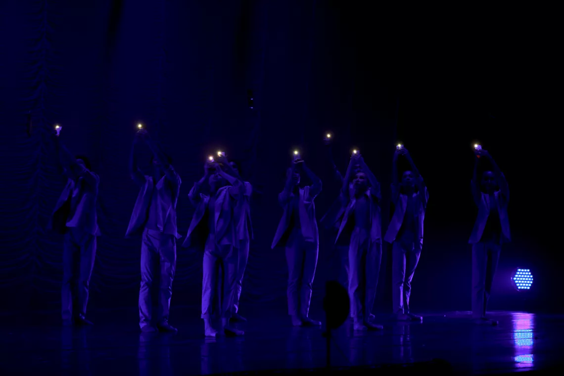 Air pollution in Mongolia: Dancers raise their phones using them as torch lights.