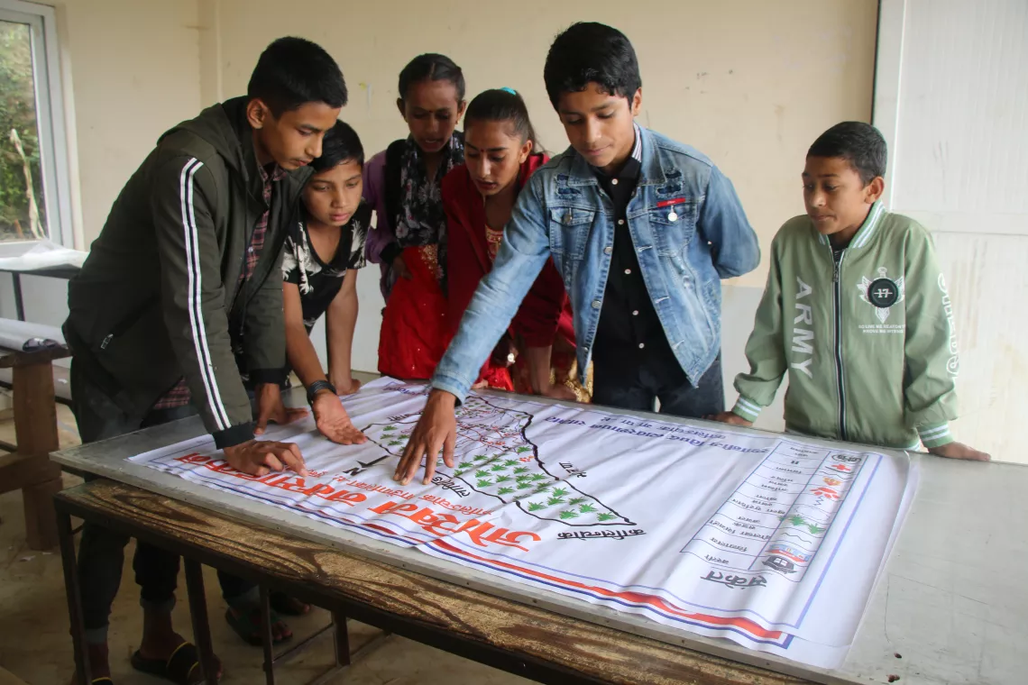 As president of a child club in the Dolakha district in Nepal, Abiraj, 14, leads club participants in planning for disaster preparedness extracurricular activities.