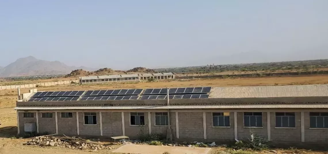 School pictured with solar panels on the roof. 
