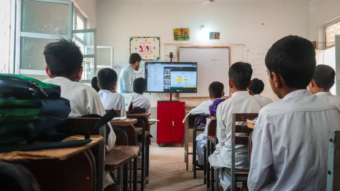 Teacher engages students in an online lesson in Pakistan.